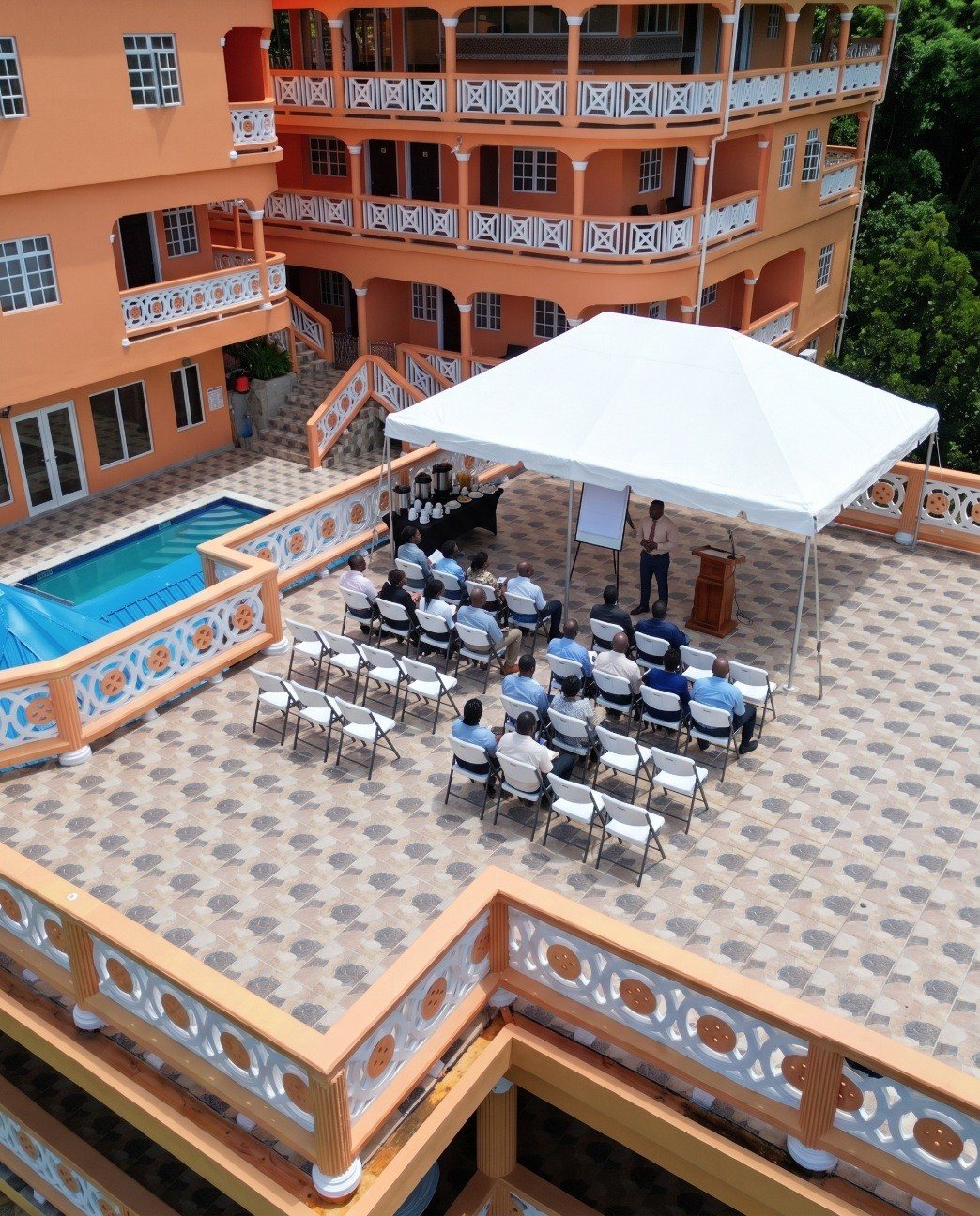 Corporate meeting under a tent on the hilltop terrace
