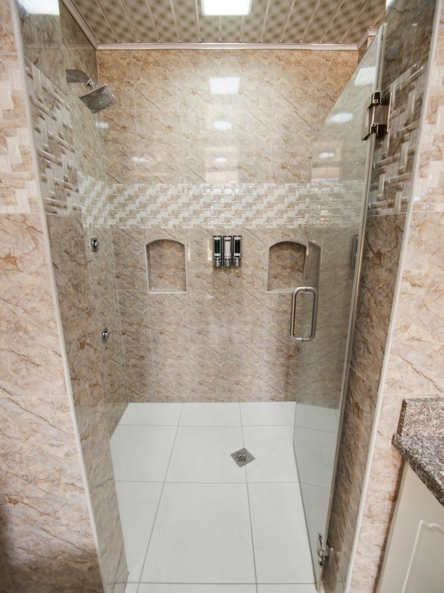 Poolside Suite walk-in shower with glass door