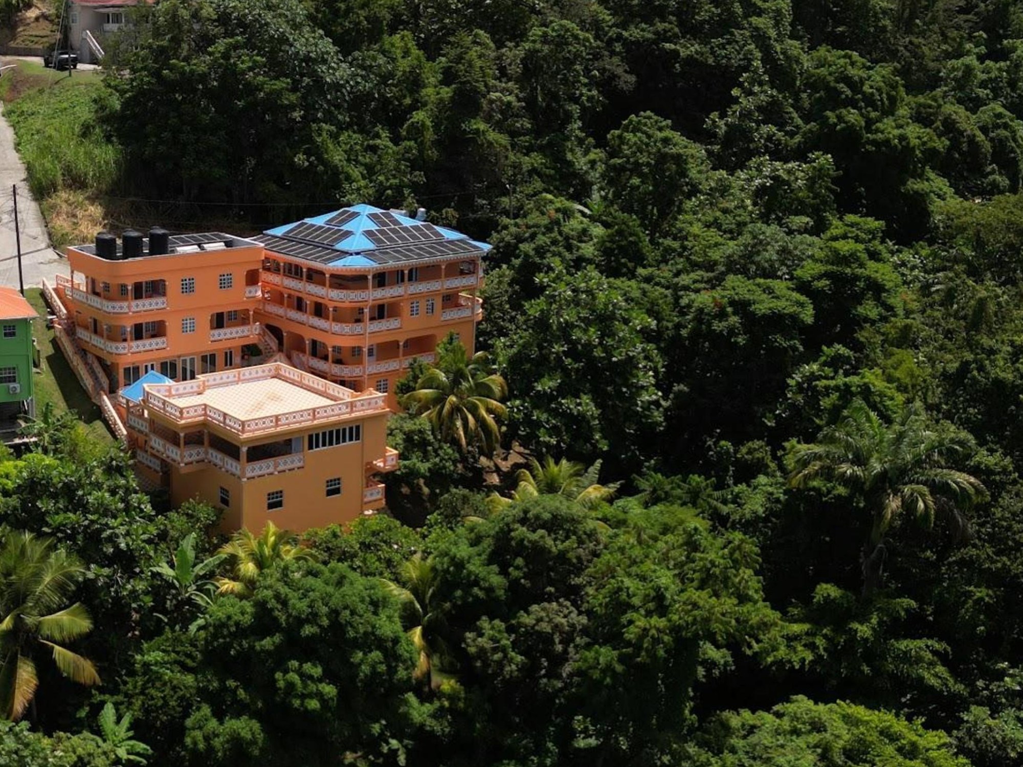 Aerial view of Union Hilltop Paradise Villas surrounded by tropical forest in Union, northern Saint Lucia