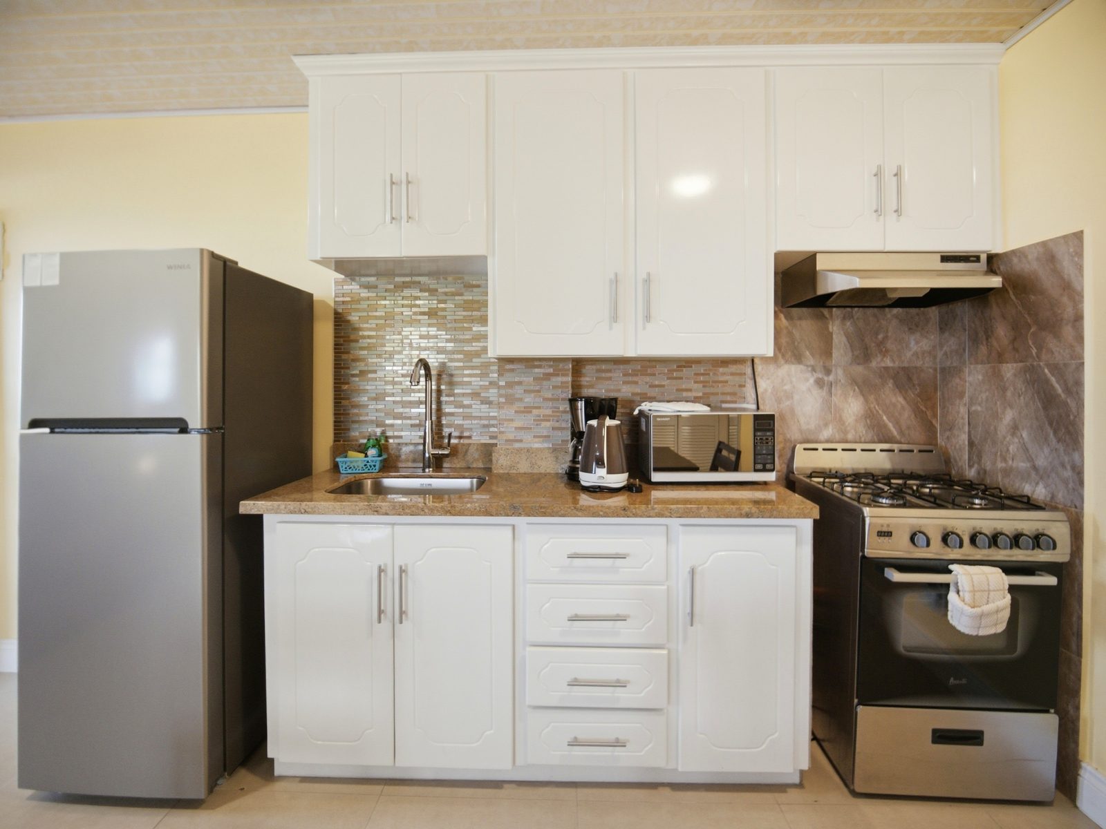 Studio kitchenette with full-size appliances