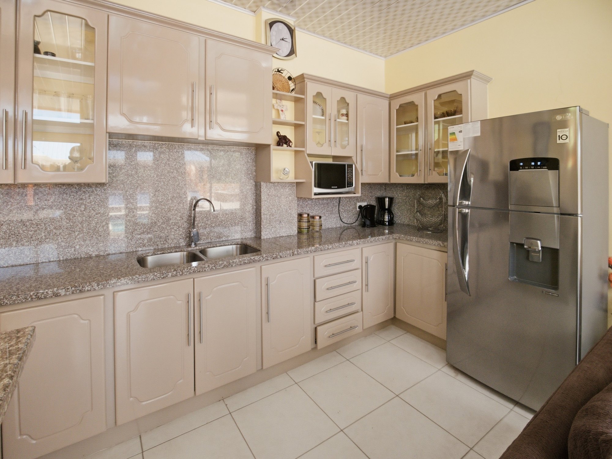Poolside Suite kitchen with granite counters and full-size fridge