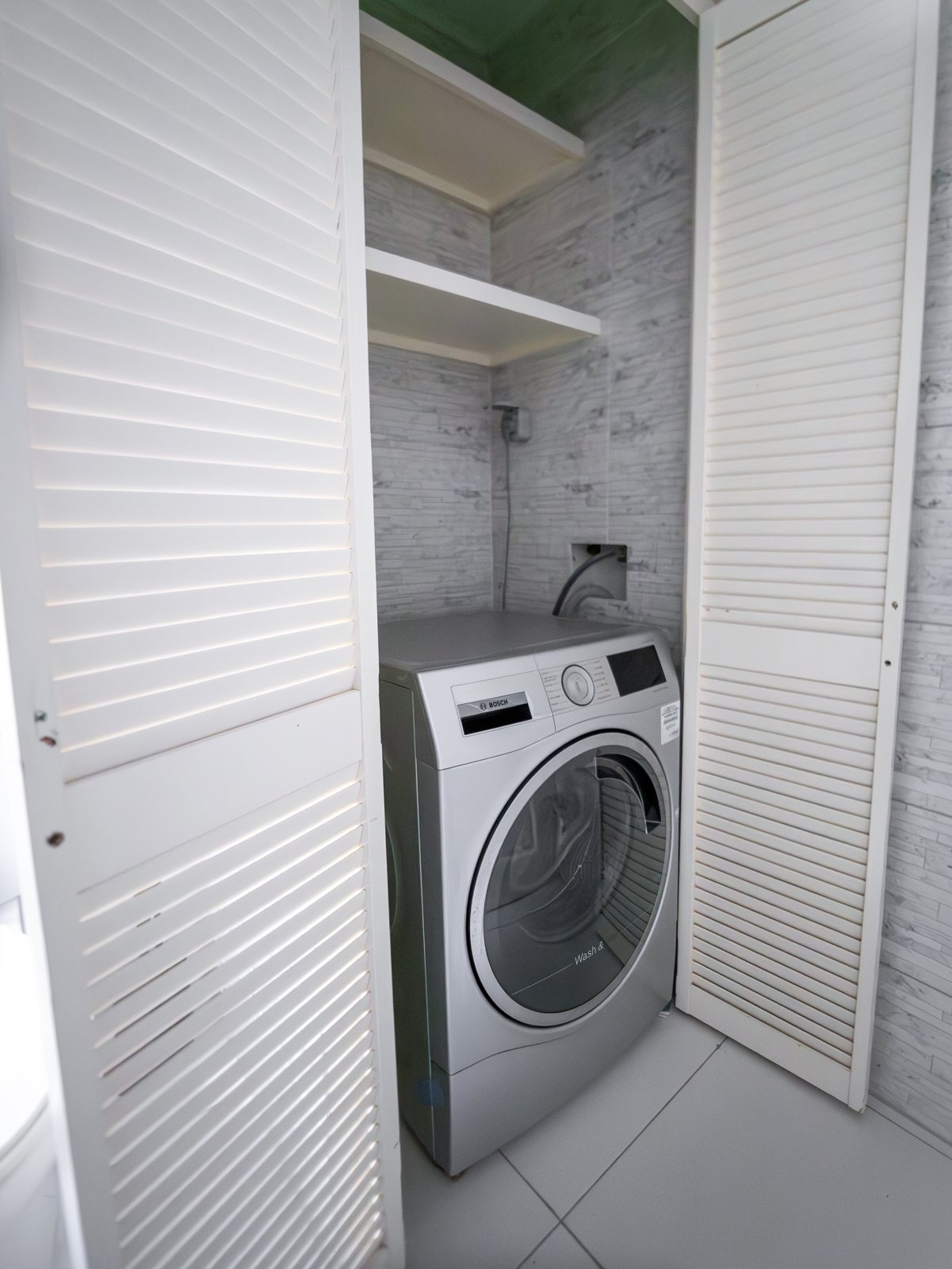Two Bedroom washer and dryer in a louvered closet